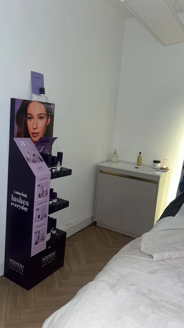 Lash products and a treatment bed in the boutique